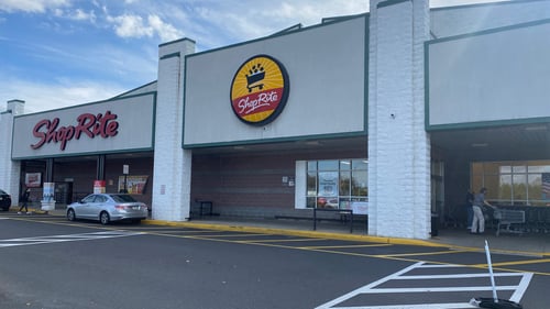 Silver car parking along entrance of Shop Rite at Warminster Towne shopping Center