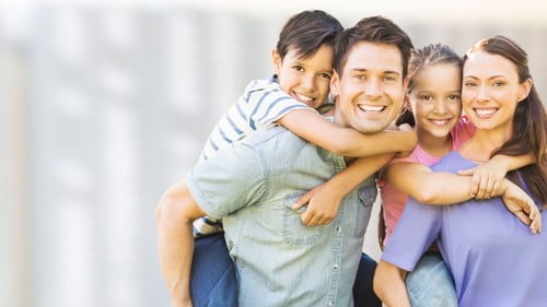 Smiling family of four