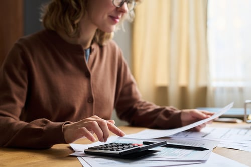women using a calculator