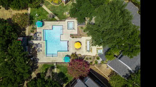 Aerial view of the swimming pool at Trinity Apartments, Irving, Texas