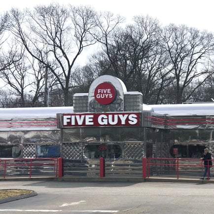 Exterior photograph of the Five Guys restaurant at 143 Gold Star Highway in Groton Connecticut.