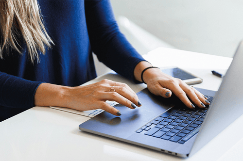 Woman typing on her computer.