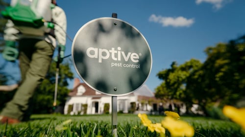 Aptive Pest Control professional providing residential pest control service at a home