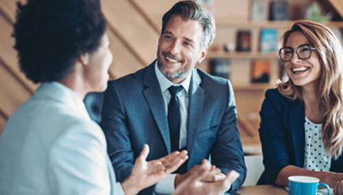Three business professionals in a meeting.
