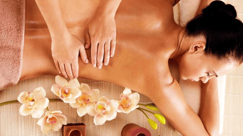 woman getting her lower back massaged