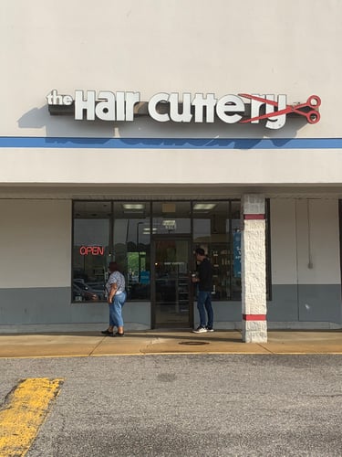 The front entrance of Hair Cuttery at Hampton Plaza.