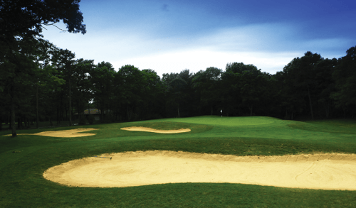 Falmouth Country Club hole view of green with surrounded sand bunkers.