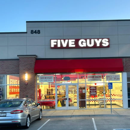Exterior photograph of the Five Guys restaurant at 848 Cornhusker Road in Bellevue Nebraska.