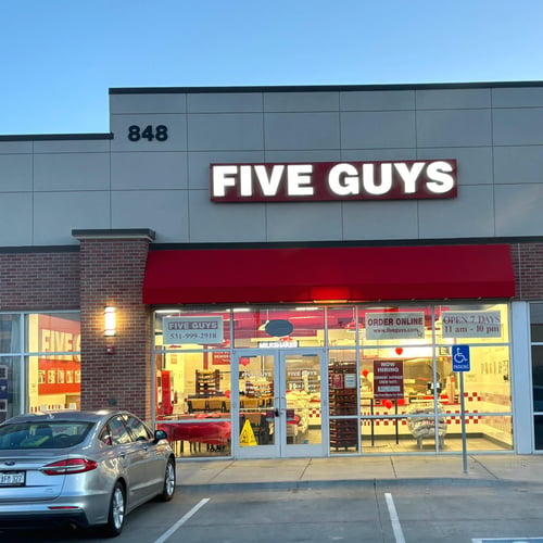 Exterior photograph of the Five Guys restaurant at 848 Cornhusker Road in Bellevue Nebraska.