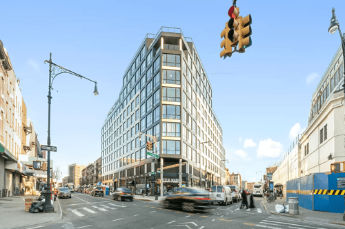 Modern residential building at busy urban intersection at 1134 Fulton Street Apartments, Brooklyn, 11216