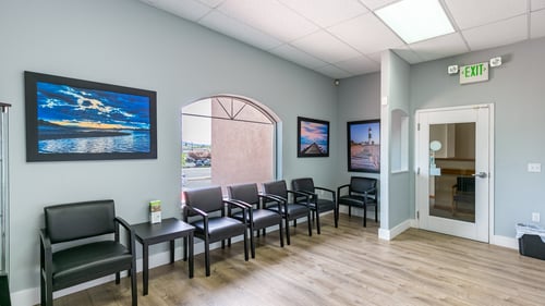 Gentle Dental Klamath Falls waiting room with seating and a prominent picture on the wall.