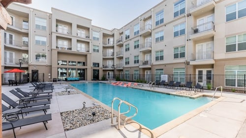 Swimming Pool Area With Shaded Chairs at Residences at 3000 Bardin Road, Grand Prairie, TX, Texas