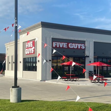 Exterior photograph of the Five Guys restaurant at 625 West Highway 30 in Gonzales Louisiana.