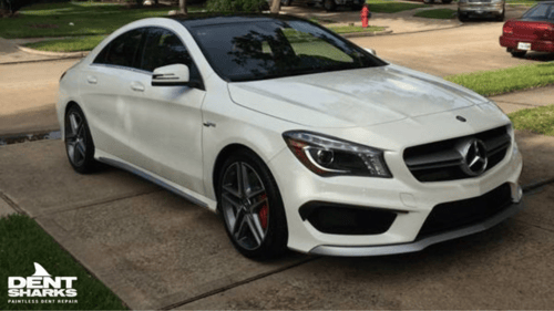 white car in the driveway
