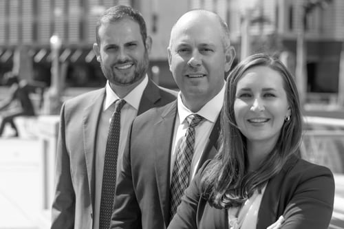 Photo of attorneys Lance W. Dunford, Scott T. Moorey, and Jill Prenger