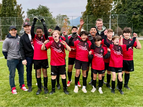 Wade Stolz with coaches and players from his son's youth soccer team in Kelowna.