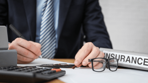 insurance agent filling out forms