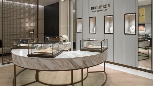 Bucherer Fine Jewellery display area at Bal Harbour with marble showcases and refined design.