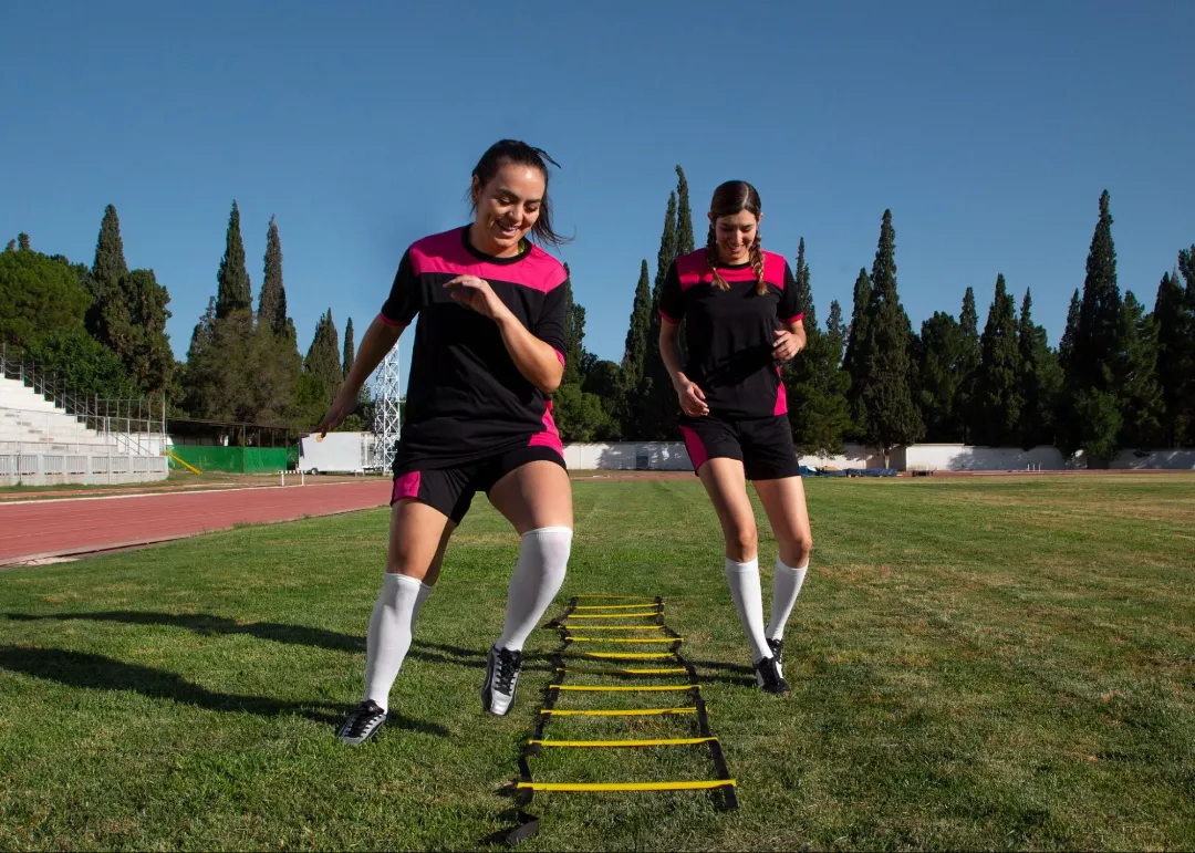 young soccer players practicing agility