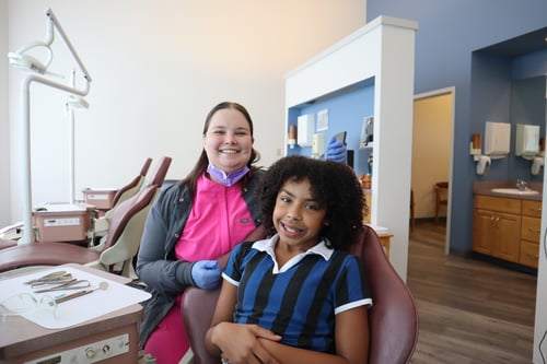Orthodontist posing with patient