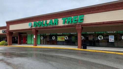 Wet asphalt in front of Dollar Tree entrance