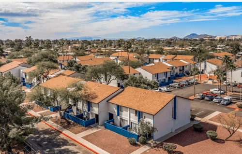 Aerial view of Midtown on Seneca Apartments showing buildings, parking areas, and surrounding neighborhood horizon.