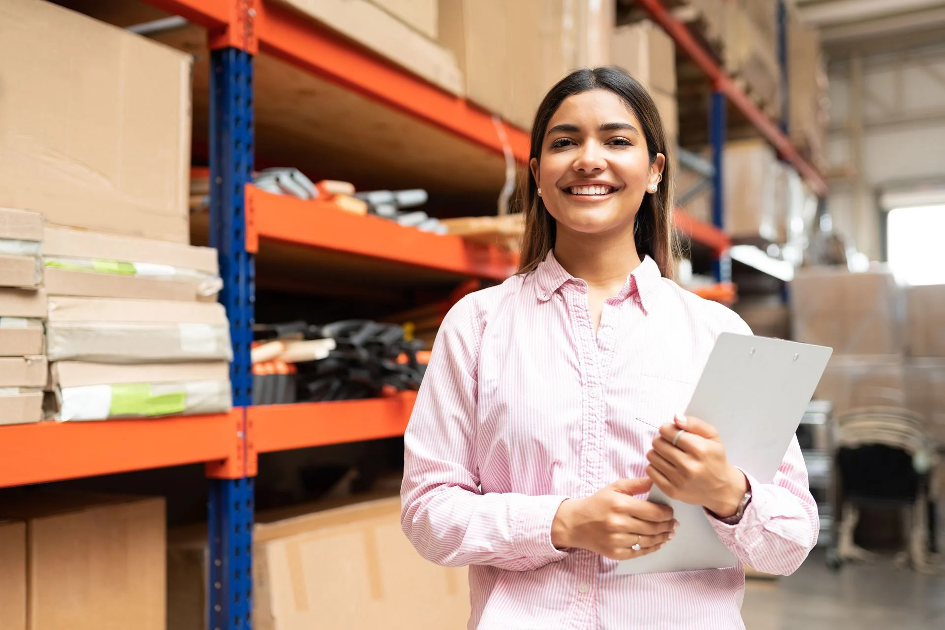 worker happily standing on workfloor