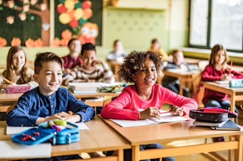 Children learning in their classroom.