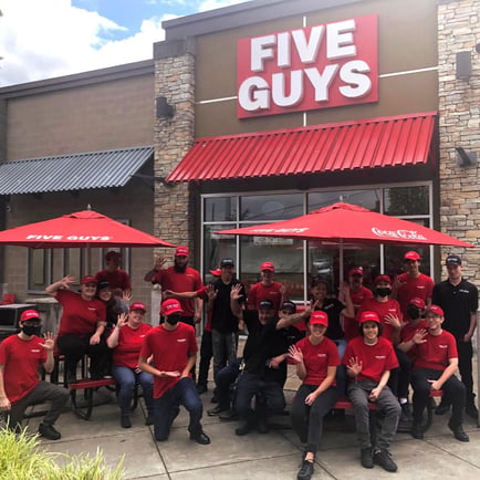 Five Guys crew members pose in front of store at 2902 164th Street SW in Lynnwood Washington.