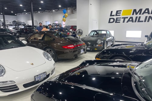 different Porsches on display at Wealth & Wheels event