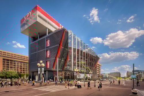 Exterior of the spy museum against a blue sky in washington DC.