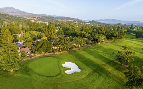 Aerial shot of Silverado golf green and sand bunker with Napa Valley hills in the background