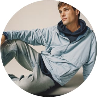 man wearing jeans and a hoodie