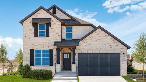 two-story home with light brick exterior