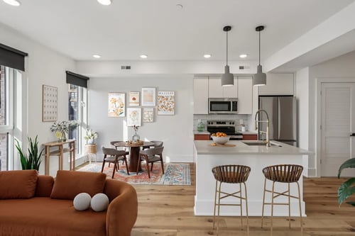 Living room and modern kitchen at The Iron Rose in Philadelphia, PA