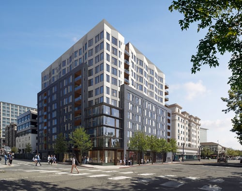 two toned apartment building at an intersection