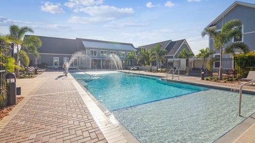 Swimming pool with a fountain at Palm Grove, Ellenton, FL 34222