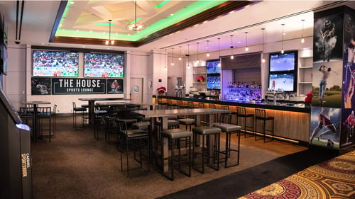 The House Sports Lounge at Caesars Windsor interior with TV's and bar seating.