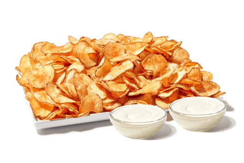 Platter of crunchy tater chips with ranch dipping sauce.