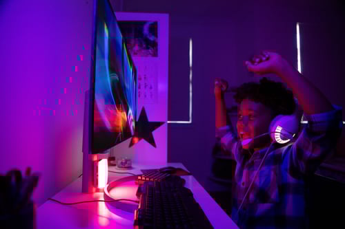 Boy using fiber internet and gaming on the internet in Denver, CO