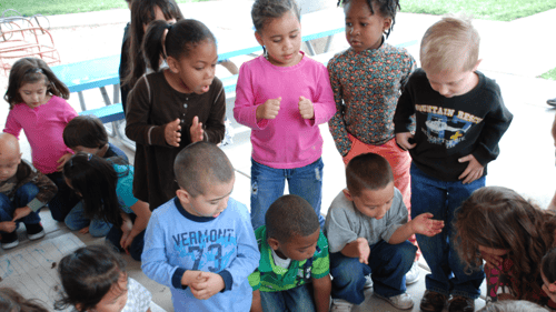 group of students gathered around outside