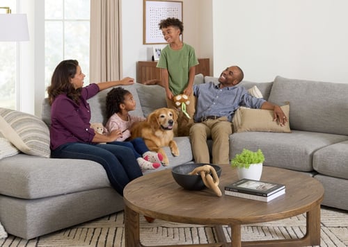 A family enjoys being together in their living room.
