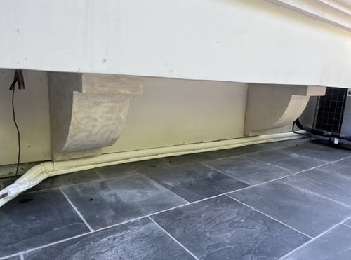 New refrigerant line installed on the perimeter of the house