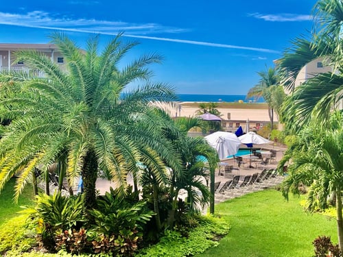 Pool area with the garden at Thunderbird Beach Resort
