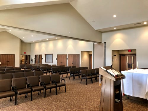 View of chapel from front by podium, outlooking chairs