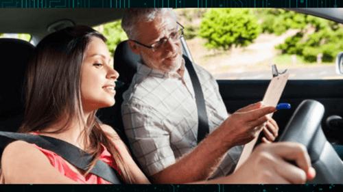instructor showing woman where to put hands on the steering wheel