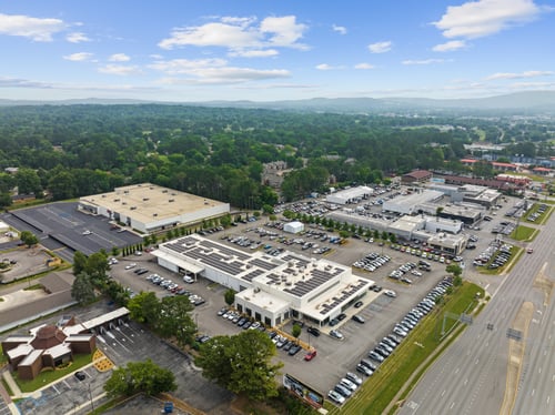Exterior of Century Collision Center in Huntsville, showing an aerial view of the entire facility and dealership. Demonstrates the shop’s large-scale capacity and modern environment for comprehensive collision repair services.