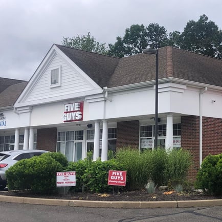 Exterior photograph of the Five Guys restaurant at 266-274 South Main Street in Newtown Connecticut.