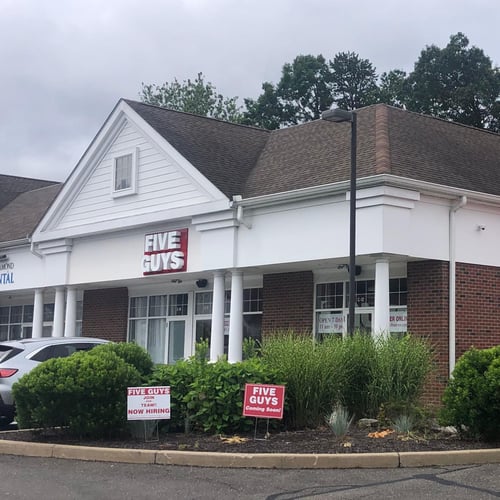 Exterior photograph of the Five Guys restaurant at 266-274 South Main Street in Newtown Connecticut.