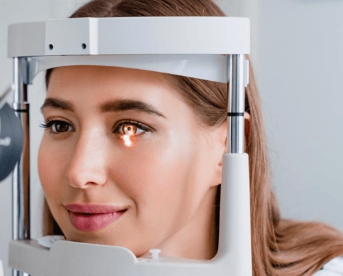 Women getting eye exam done